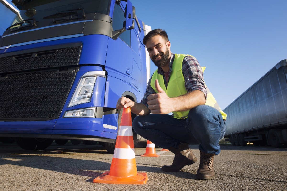 Man learning how to drive truck at driving schools.